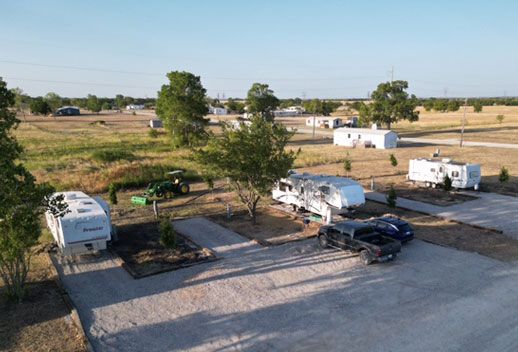 Aerial view of the RV sites and open pasture at Stoney Acres RV Park