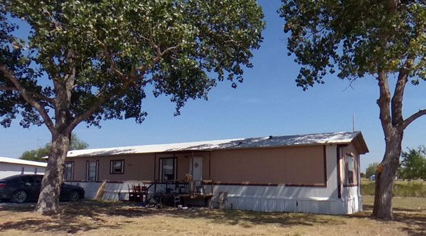 Mobile home rental shaded by mature trees